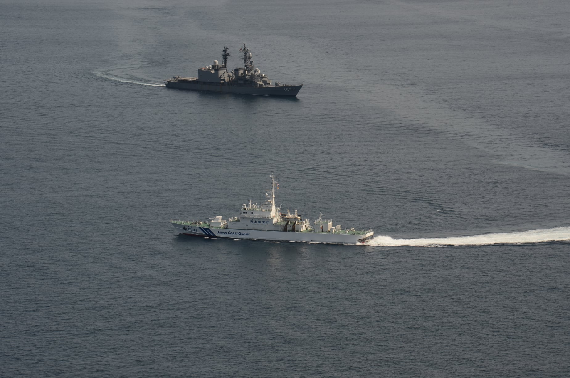 a Japanese naval vessel and a coast guard patrol ship