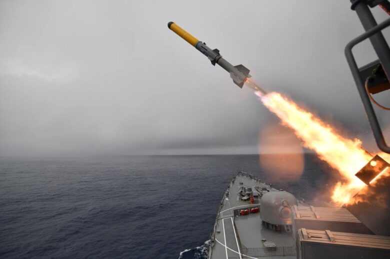 an asroc missile being fired from a ship