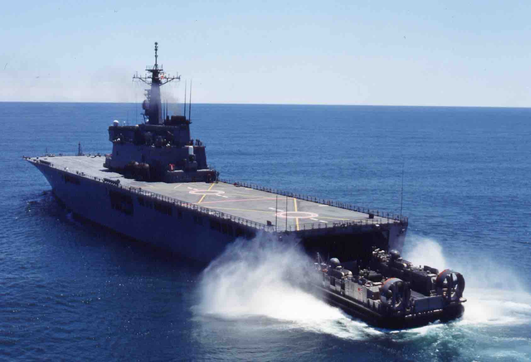 a hovercraft boat launching from a Japanese transport ship 