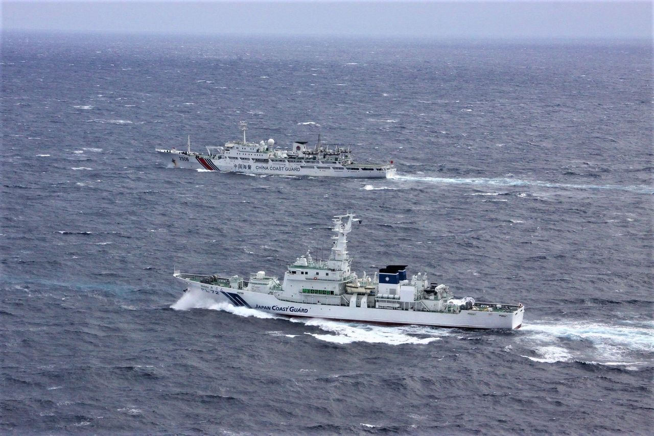 Japanese coast guard and Chinese coast guard facing each other