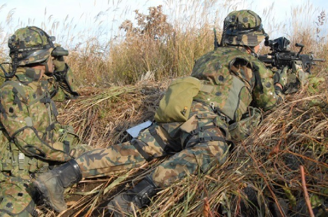 a Japanese SDF soldier holding a rifle