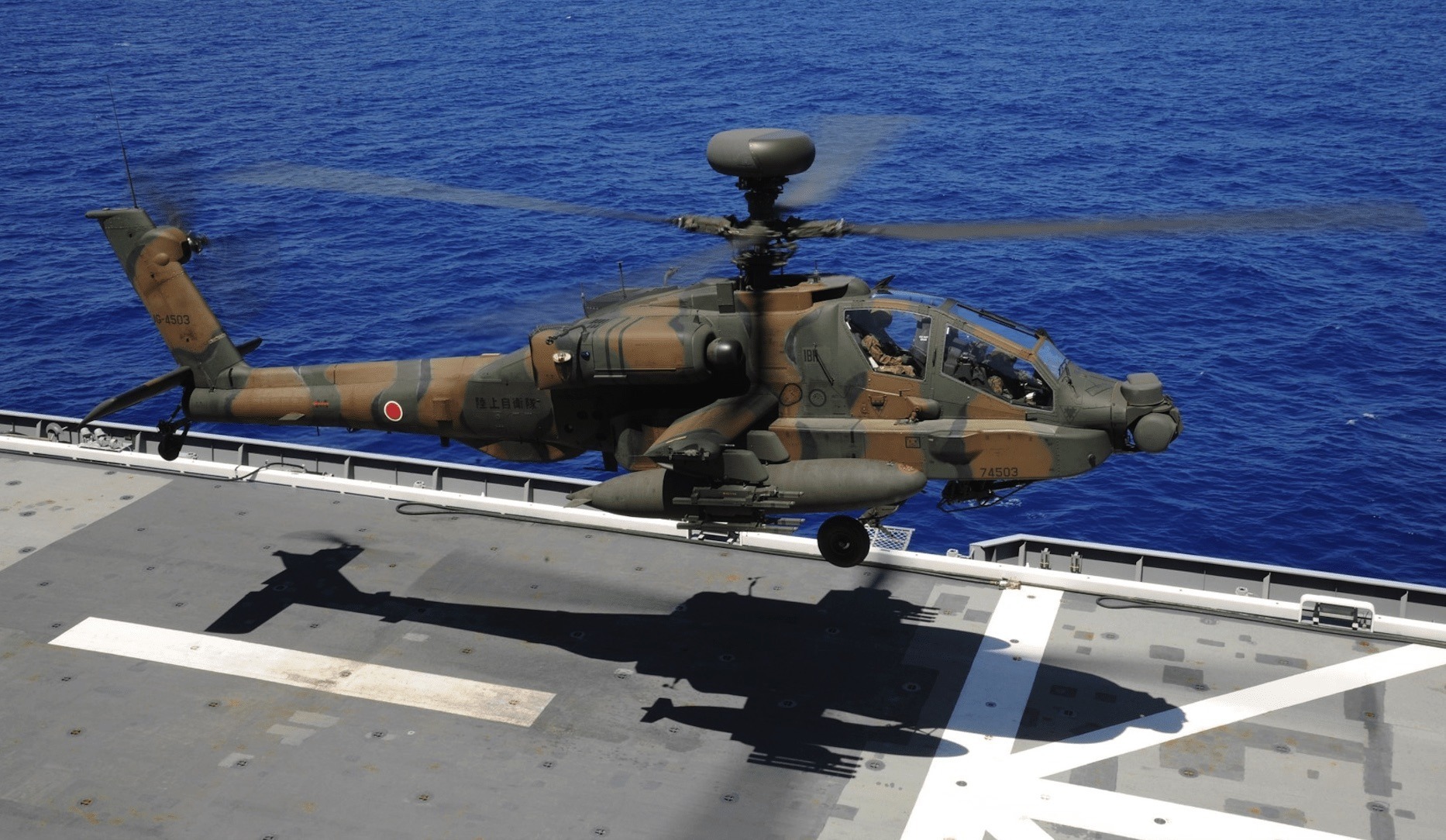 Japanese Apache helicopter landing on a carrier