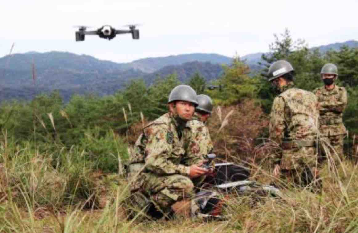 a Japanese soldier using a small drone