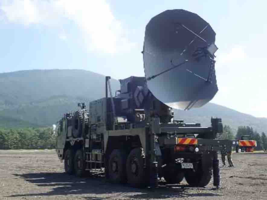 a truck with a large antenna mounted on top